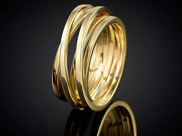 istock beautiful Golden ring isolated on black background 625242010