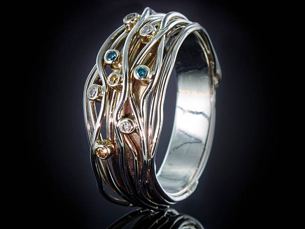 istock silver ring with gemstone isolated on black background 625242460