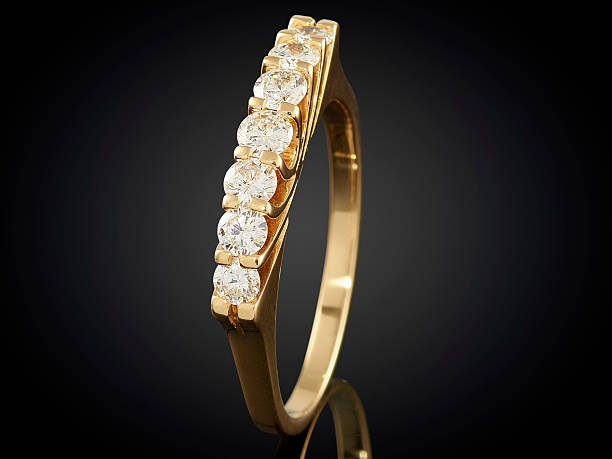 istock Golden ring with gemstone isolated on black background 625242748
