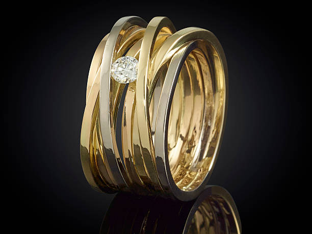 istock Golden ring with gemstone isolated on black background 625242800