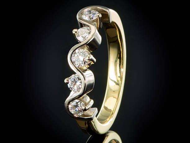 istock Golden ring with gemstone isolated on black background 625243152
