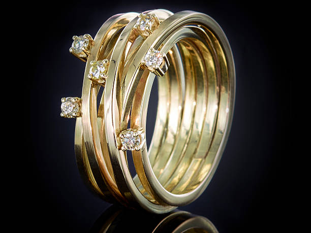 istock Golden ring with gemstone isolated on black background 625243180