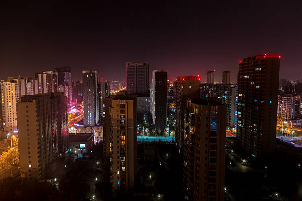 istock Qingdao city skyscrapers by night 625243868