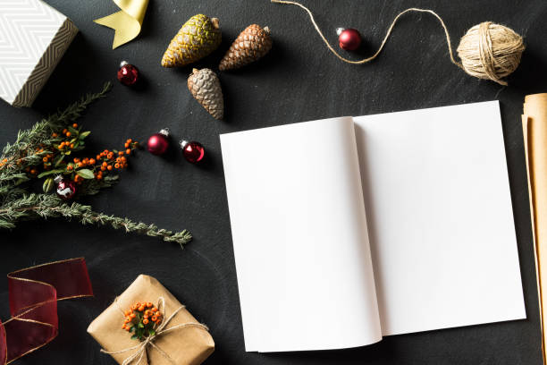 istock Open magazine with blank page in Christmas concept flat lay 625267912