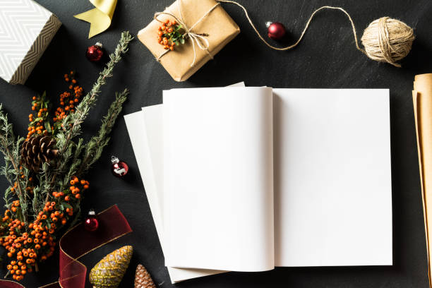 istock Open magazine with blank page in Christmas concept flat lay 625269474
