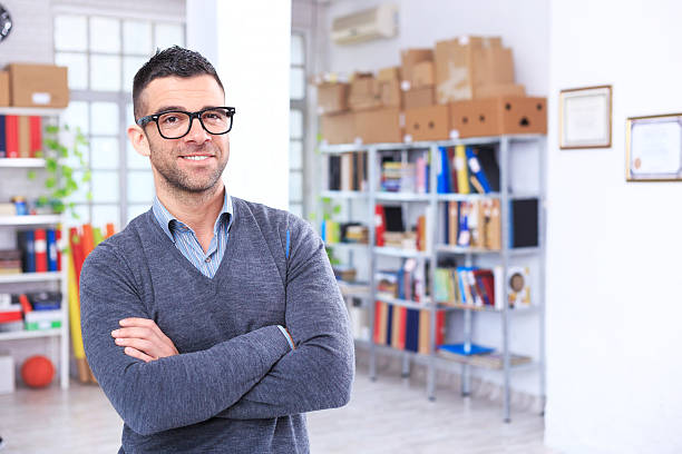 istock Smiling young man at the office, looking at camera 625270710