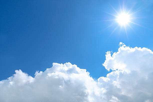 istock sun shines on blue sky and white cloud 625270728