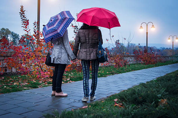 istock Two lesbian girls walking on cold autumn day 625271752