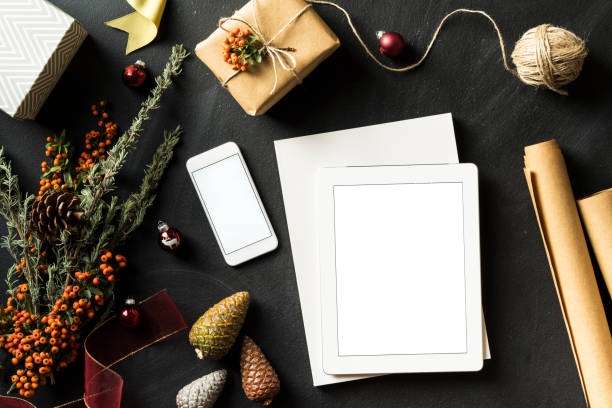 istock Blank screen tablet pc, phone, white magazine, Christmas flat lay 625272536