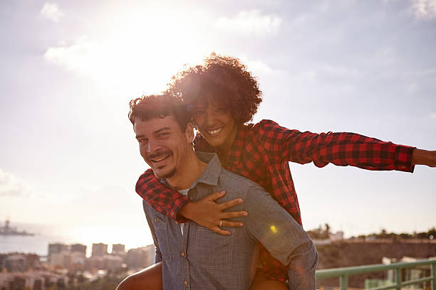 istock Loving young couple playing piggy back 625272568