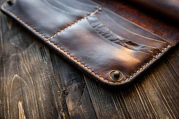 istock Brown leather wallet on wooden table, Old 625279514