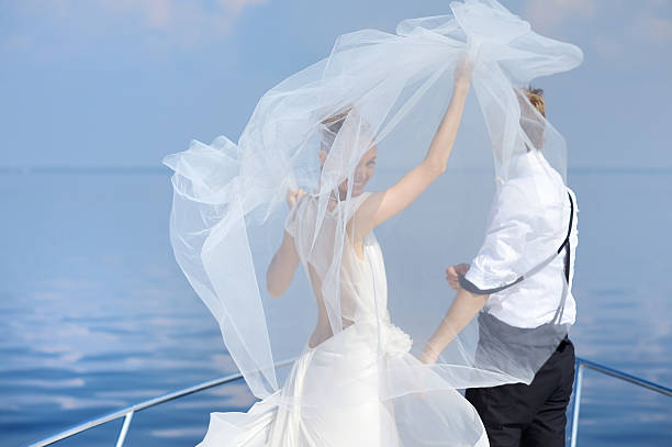 istock Happy bride and groom on a yacht 625279724