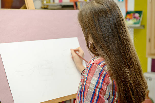 istock Smiling young artist girl draw 625280030