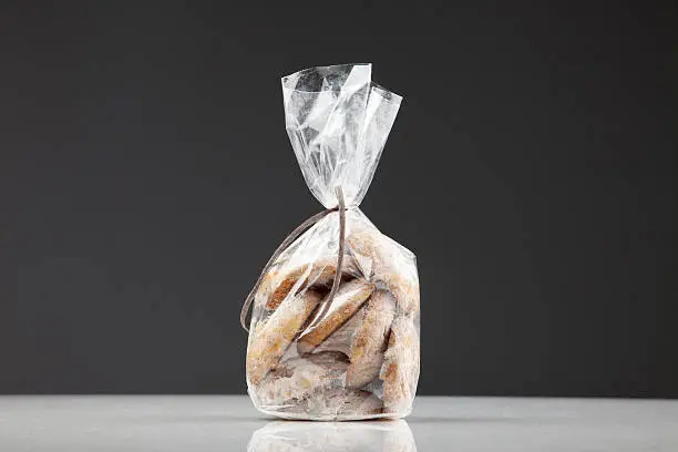 Cellophane Package of Homemade Cookies (Studio Shot, Dark Background). Horizontal format. Shot with Canon EOS 5D.