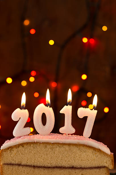 istock 2017 candles burning on top of a cake 625281078