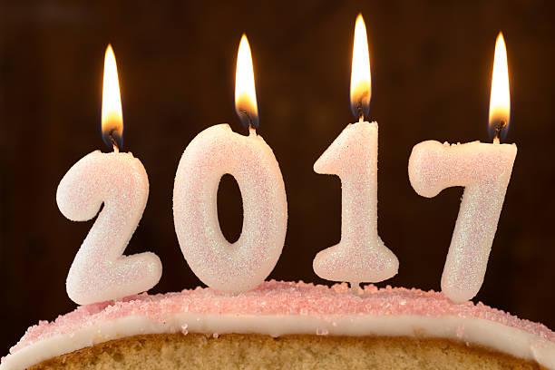 istock 2017 candles burning on top of a cake 625281086