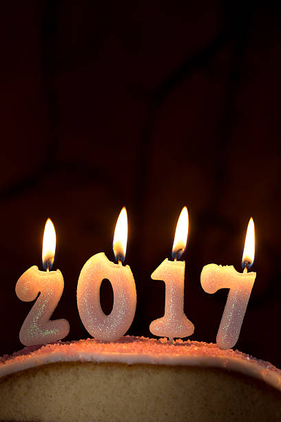 istock 2017 candles burning on top of a cake 625281094