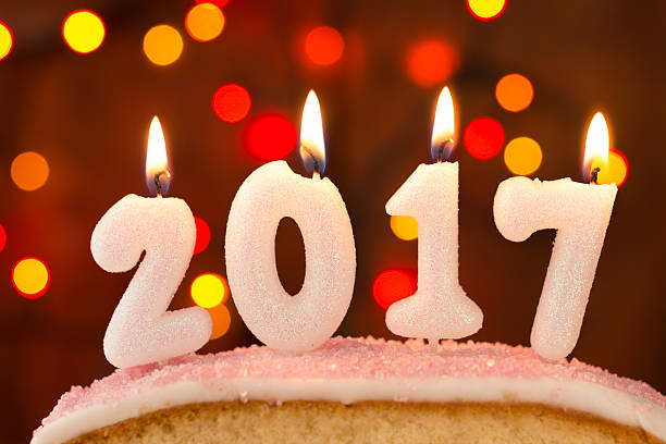 istock 2017 candles burning on top of a cake 625281132