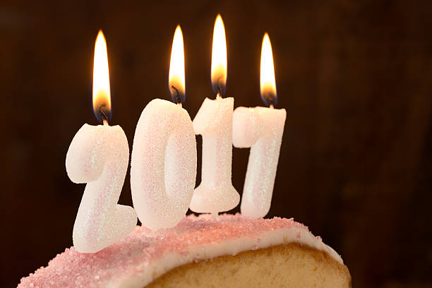 istock 2017 candles burning on top of a cake 625281172