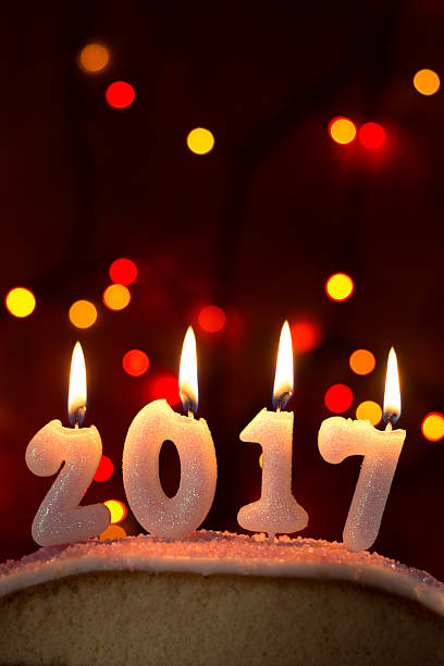 istock 2017 candles burning on top of a cake 625281250