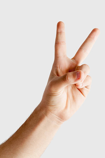 istock Person making peace sign, close-up 625281880