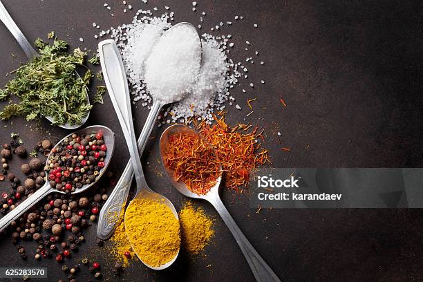 Various Spices Spoons On Stone Table Stock Photo - Download Image Now - Spice, Salt - Seasoning, Variation