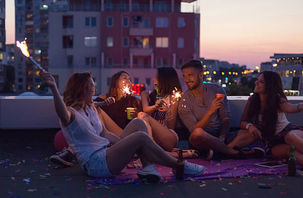 istock Happy friends enjoying a rooftop party 625284178