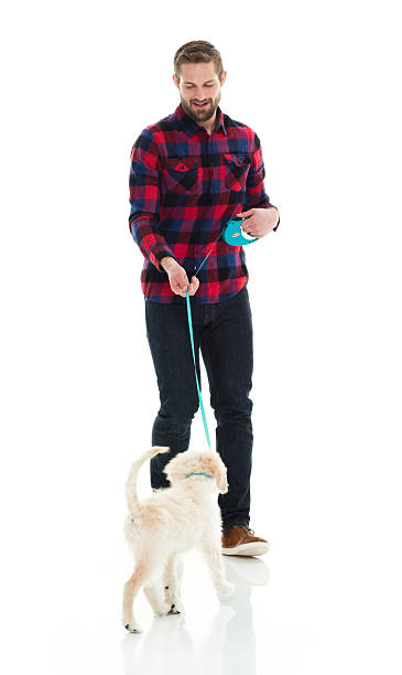 istock Casual man holding dog 625298256