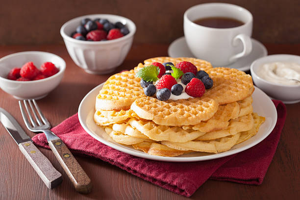 istock waffles with creme fraiche and berries for breakfast 625298274