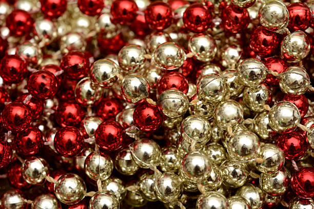 istock Pile of Gold and Red Bead Garland Christmas Theme background 625298564