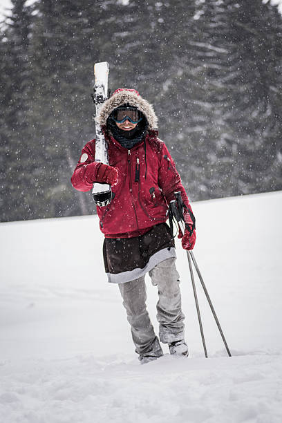istock Smiling skier carrying skis 625300742