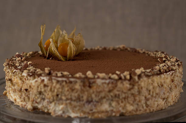 istock Tiramisu cake with berries on a background of burlap 625301470