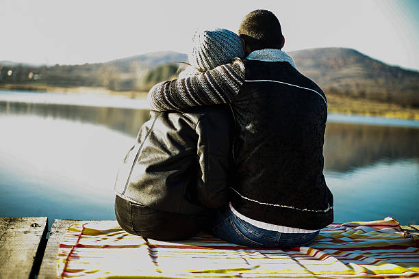 istock Young couple hugging and enjoying on the pier 625303888