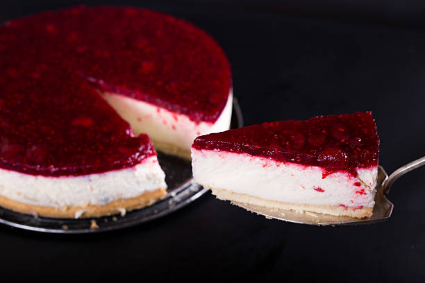 berry cheesecake, on a black background, studio