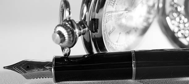 istock Pen and pocket watch 625304046