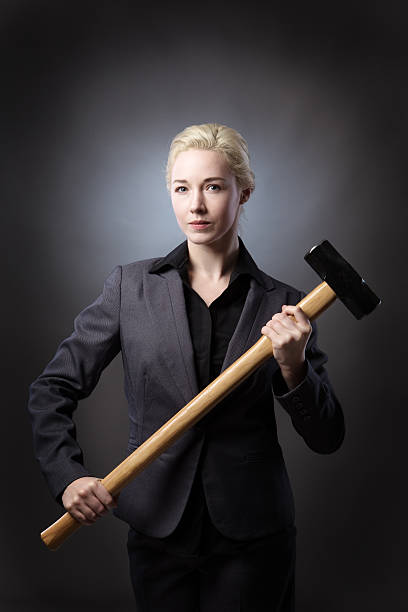 istock Woman with hammer 625304158