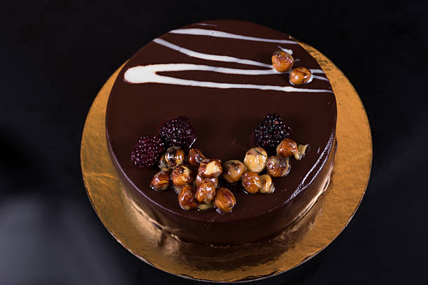 istock chocolate cake with nuts coated with a glaze 625304332