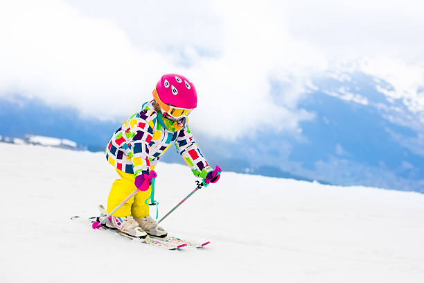 istock Ski and snow fun. Child in winter mountains. 625308236