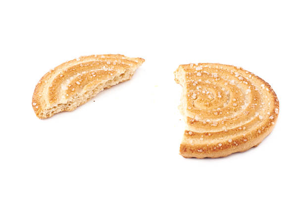 istock Broken into pieces cookie isolated over the white background 625308858