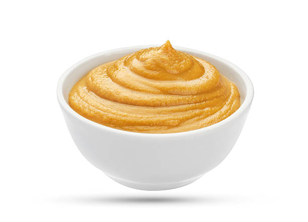 istock Mustard in bowl isolated on white background 625309032