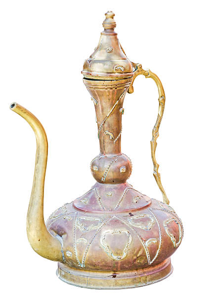 Antique east jug isolated on white background. Retro arabian teapot.