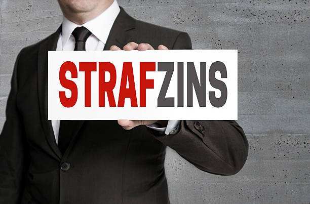 istock Strafzinz (in german negative interest) sign is held by business 625329140