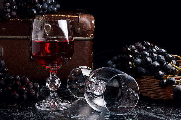 istock Glass of red wine on dark marble background. 625329450