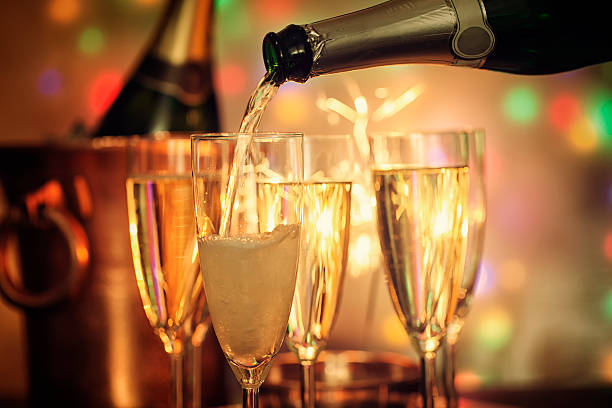 istock Pouring Champagne into Champagne Flutes 625332538