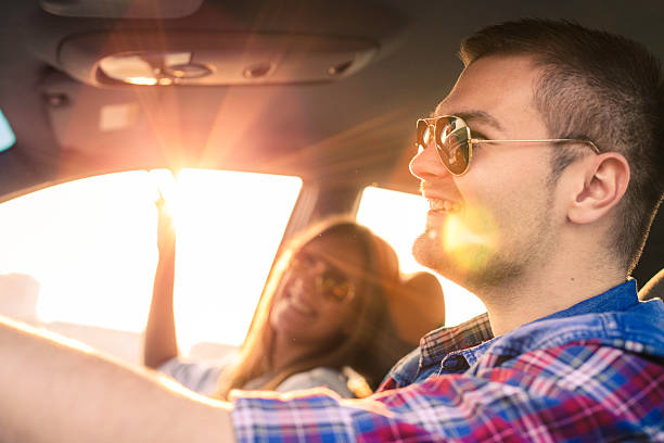 istock Happy Couple driving in car 625354346