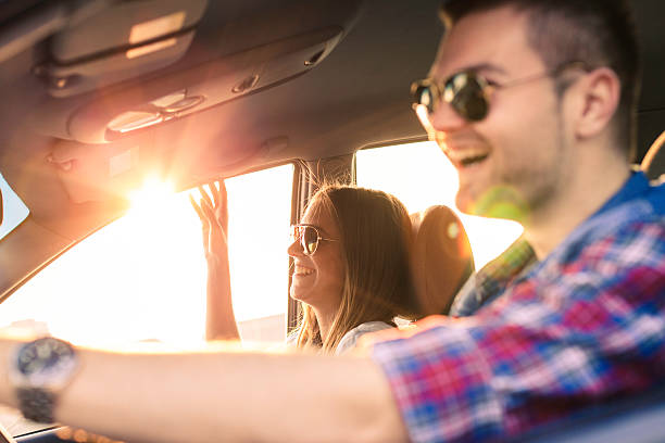 istock Happy Couple driving in car 625354416