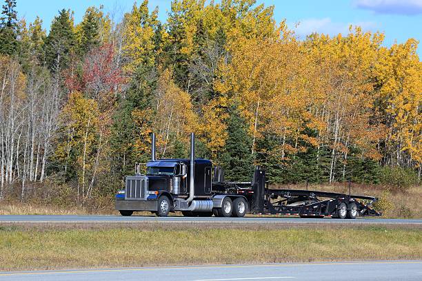 istock Semi truck trailer on an interstate highway, trees in background. 625356884