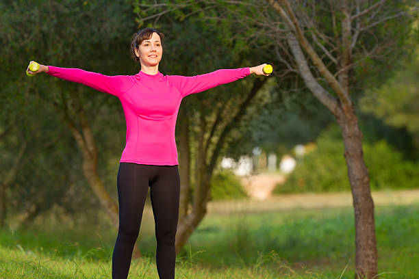 istock women doing weight training outdoors 625357802