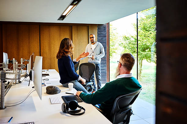 istock Business colleagues discussing work in office 625376030