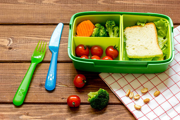istock lunch box for kid with fresh vegetables on wooden background 625379282
